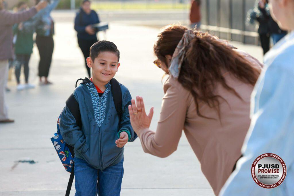 Student getting a High Five.