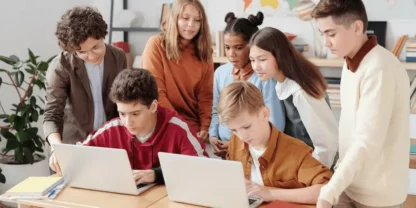 Students looking at laptops